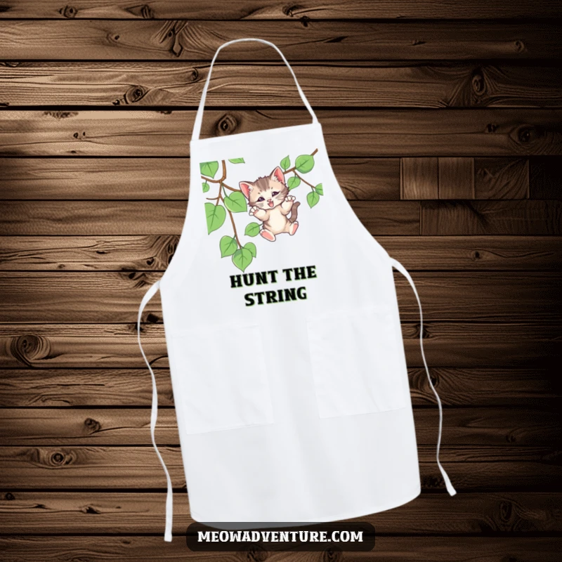 Funny apron showing a kitten hilariously pouncing on a dangling vine, perfect for adding humor to cooking and baking.
