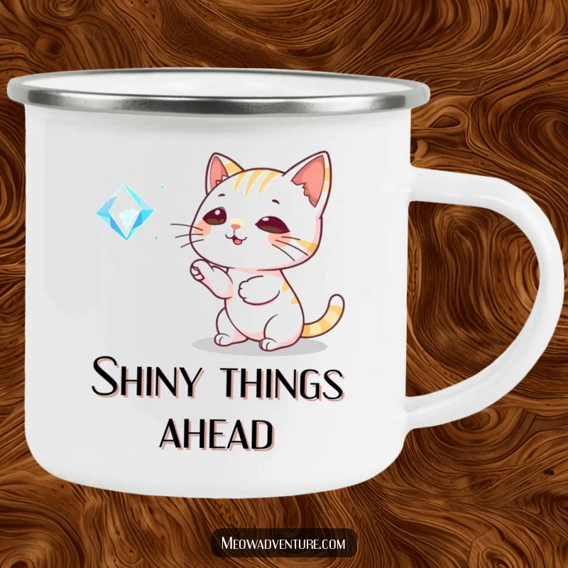 Funny Cat Camping Mug: A playful cat bats at a sparkling gem, ideal for outdoor adventures and humorous sipping.