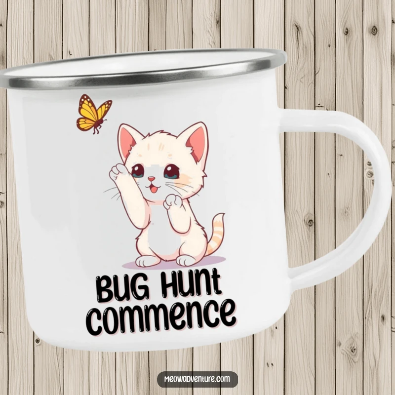 Funny curious kitten batting at a butterfly, printed on a camping mug, for playful outdoor moments.