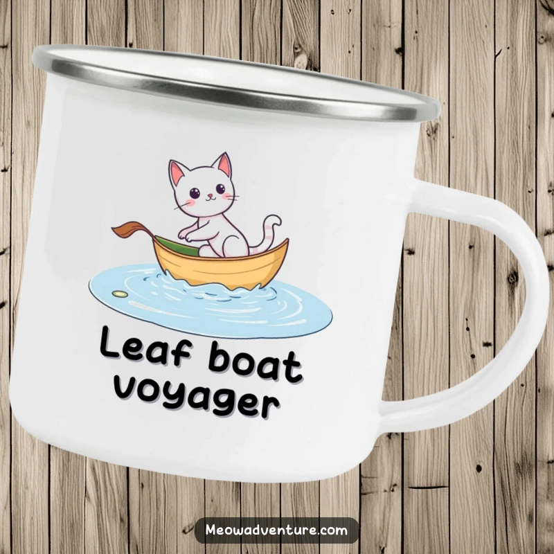 Funny camping mug: an adventurous cat sailing on a leaf boat, designed for exploring the great outdoors.