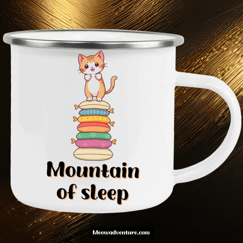Funny camping mug showing a brave cat climbing a tall stack of colorful cushions, for outdoor adventurers.