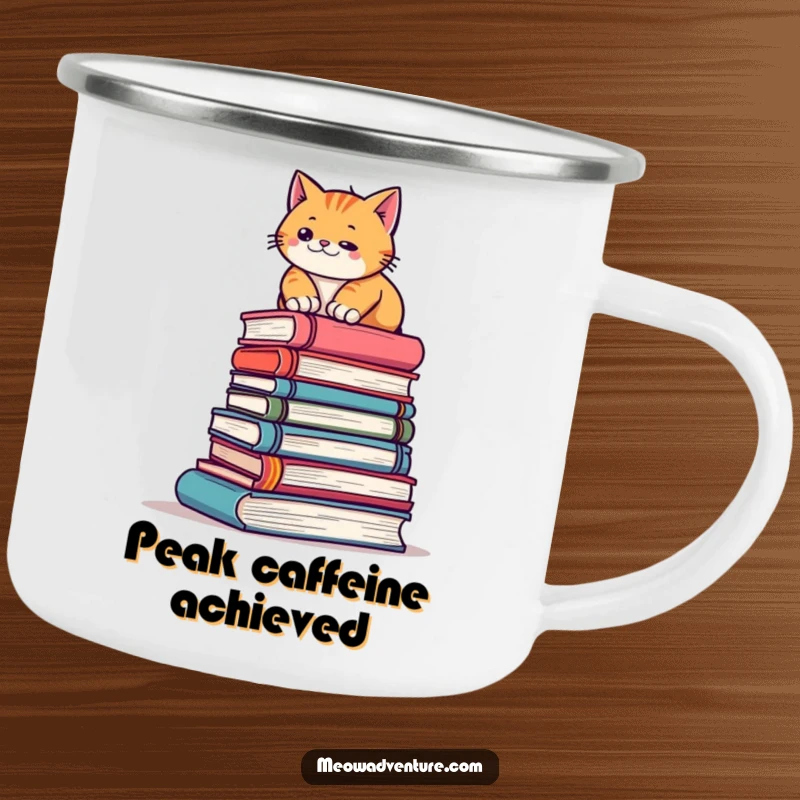 Funny camping mug showcasing a determined cat scaling a stack of books during an outdoor adventure, perfect for coffee lovers.