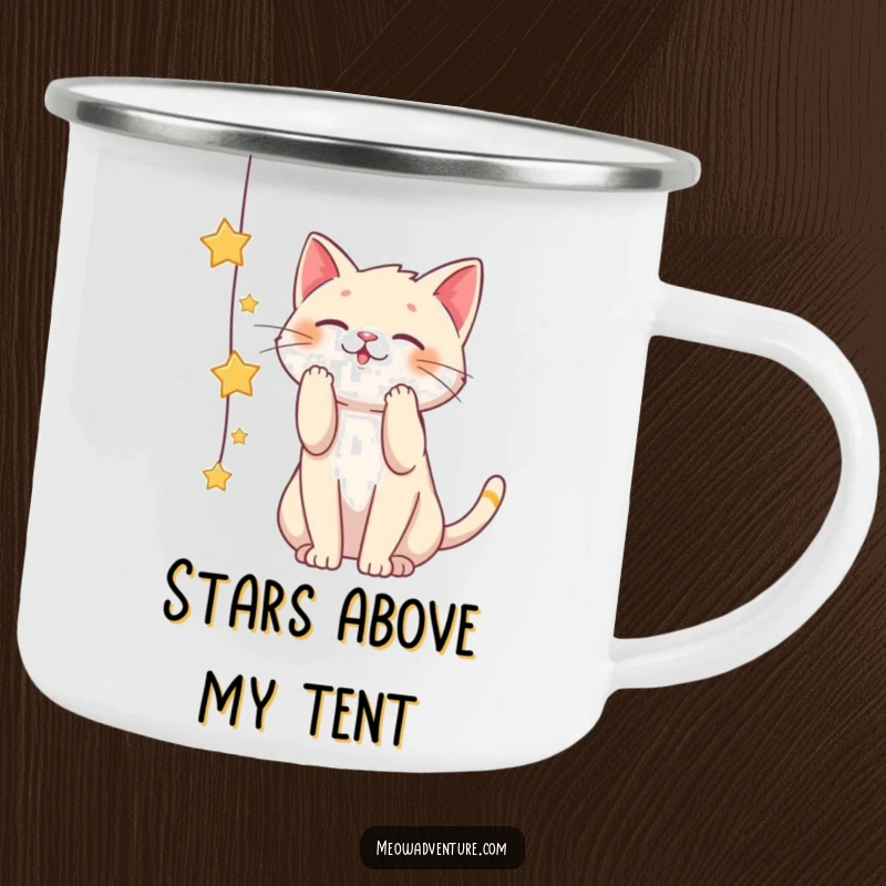 Funny camping mug with a playful cat batting at a string of stars, perfect for dreamers and adventurers.