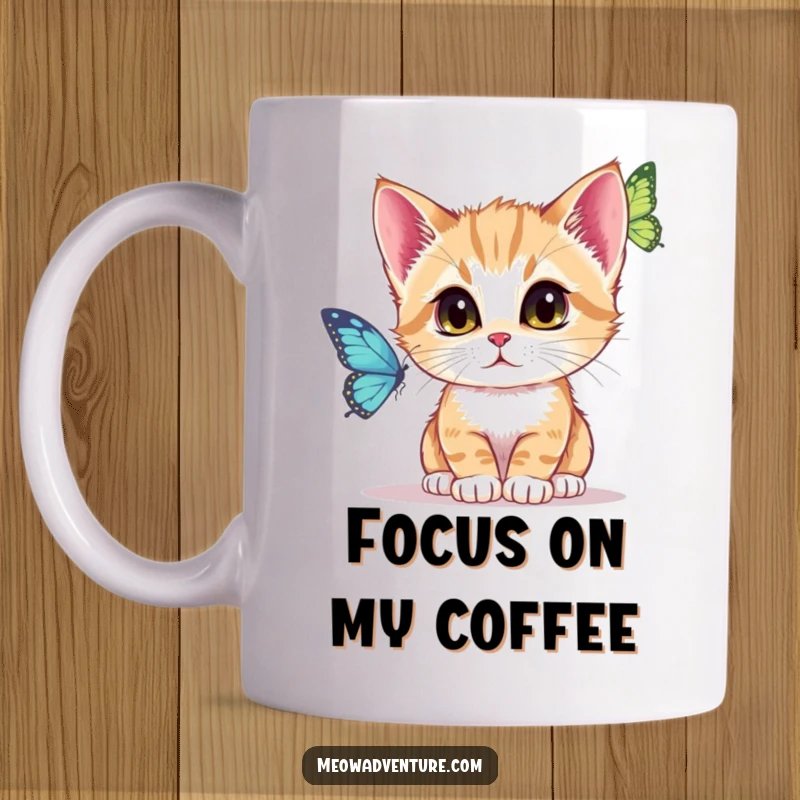Funny Mug showing a kitten intently watching a fluttering butterfly with wide, focused eyes, embodying deep concentration.