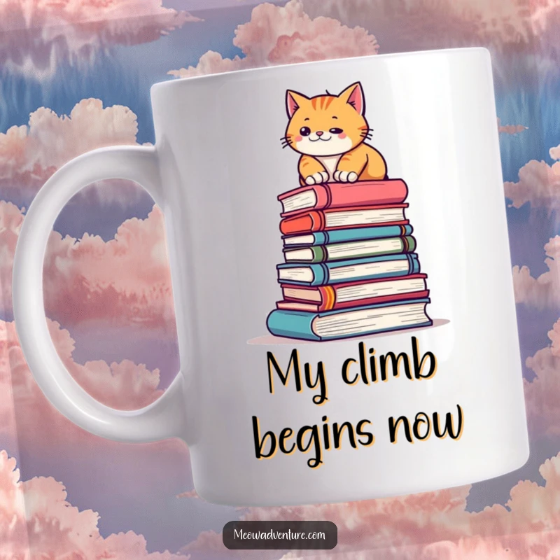 Funny mug showing a determined cat adventurously climbing a tall stack of books like a mini mountain, signifying ambition.