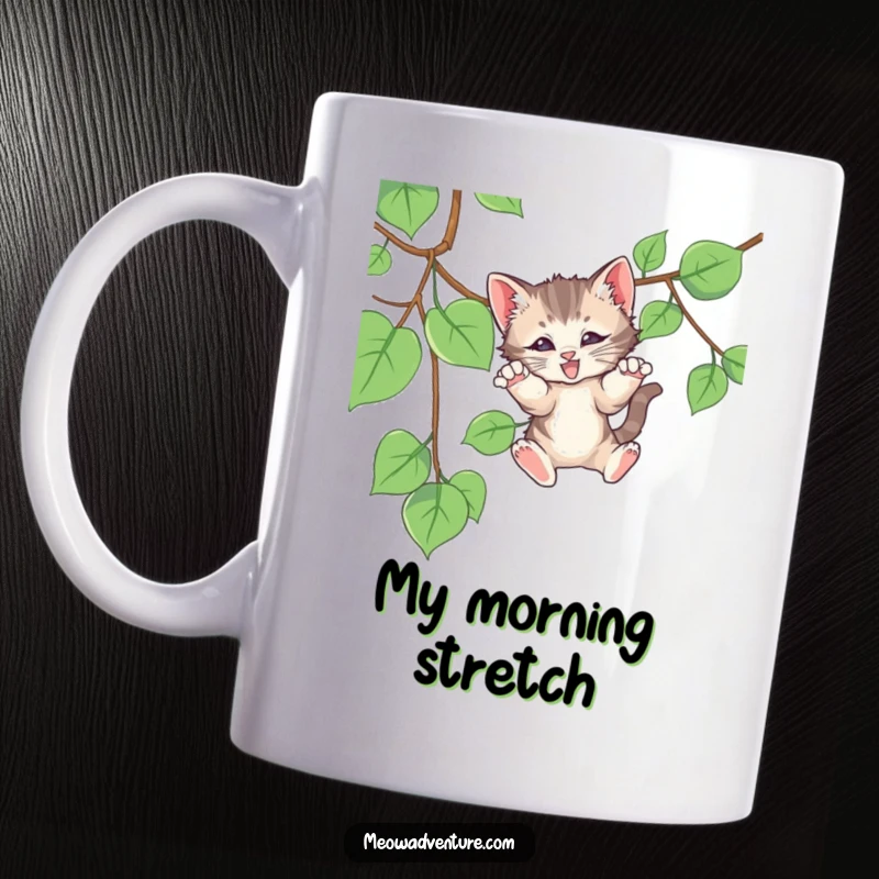 Funny mug featuring a playful kitten mid-pounce on a dangling vine, showing energetic feline fun, a perfect gift.