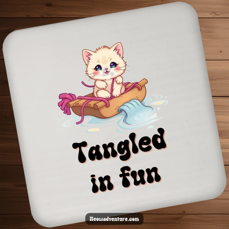 Funny fluffy kitten on a yarn raft sailing on yarn, printed on a round coaster.