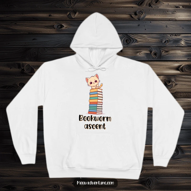 Funny kitten scaling a massive stack of books, featured on a warm hoodie, perfect for study sessions.