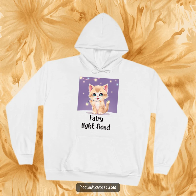 Funny warm hoodie showcasing a mischievous kitten batting at a string of glowing, twinkling fairy lights.