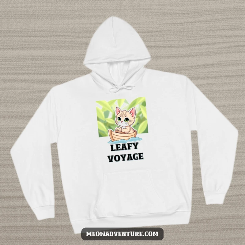 Funny hoodie showcasing a determined kitten sailing on a tiny leafy boat, offering cozy comfort and adventurous spirit.