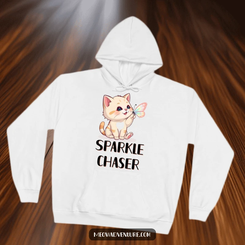 Funny hoodie showing a playful cat batting at a magical butterfly, perfect for enchanted wear.