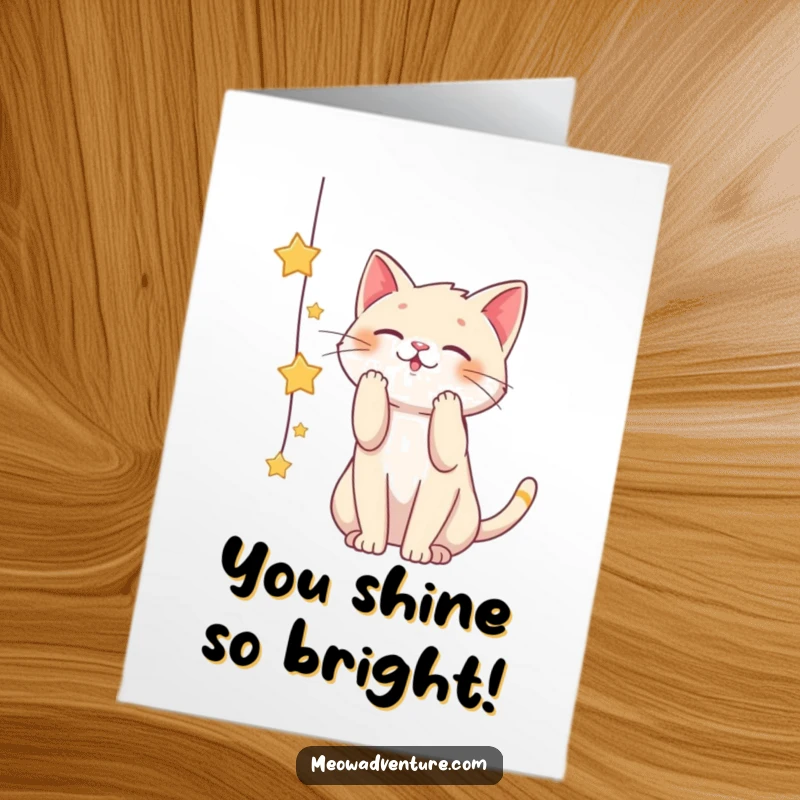 Funny Free Printable Congrats Card: A playful cat batting at a string of twinkling stars, symbolizing reaching for great achievements.