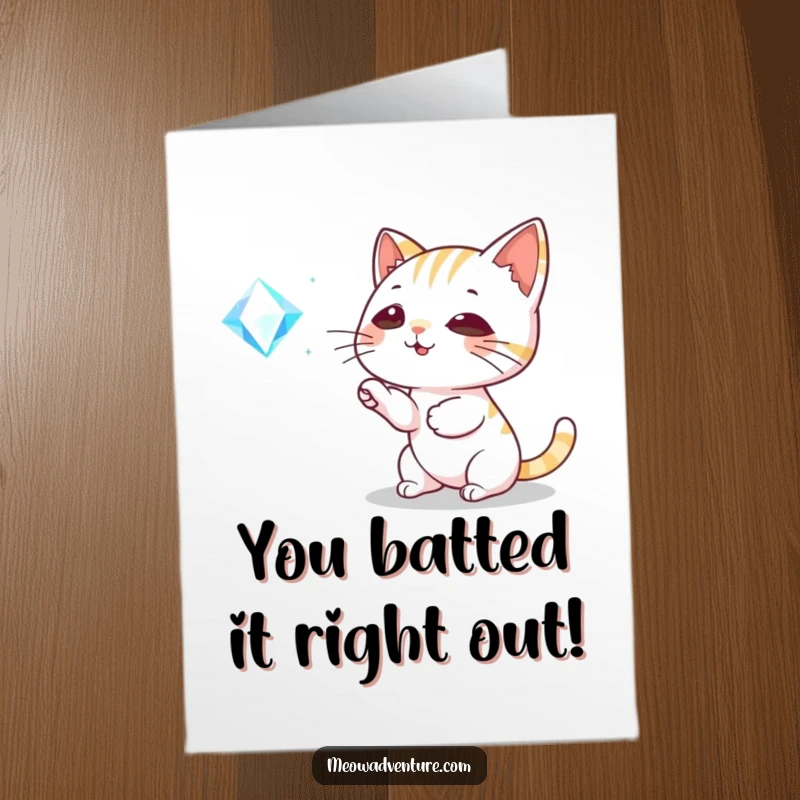 Funny Free Printable Congratulations Card: Playful cat happily bats at a dazzling, floating gem.