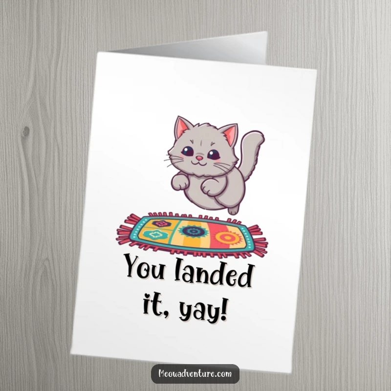 Funny Free Printable congratulations card: A fluffy grey cat in mid-air, about to land on a colorful rug.