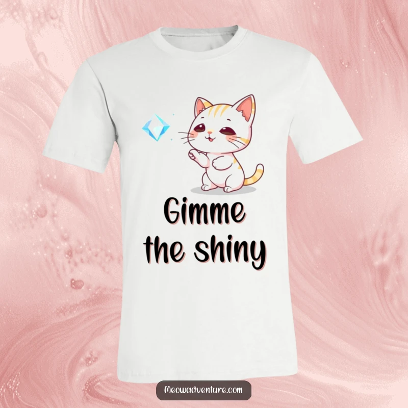 Funny Cat T-Shirt: A playful cat is captured mid-bat towards a glittering, floating gem, showcasing pure joy and feline fascination.