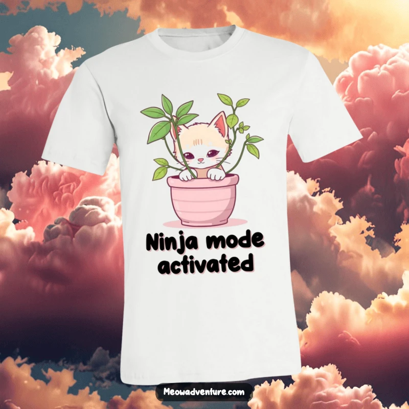Stealthy kitten t-shirt depicting a cat peeking playfully from behind a potted plant, showcasing a sense of mischief.